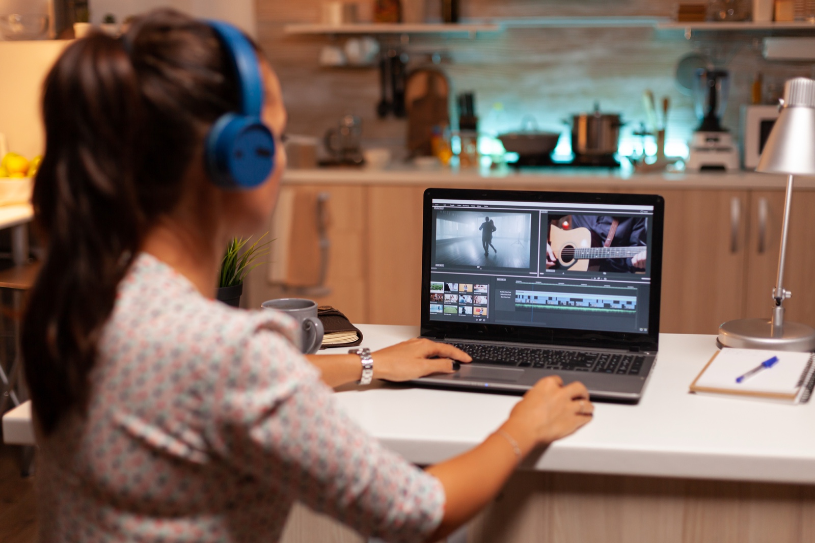 Creator editing a video on a laptop
