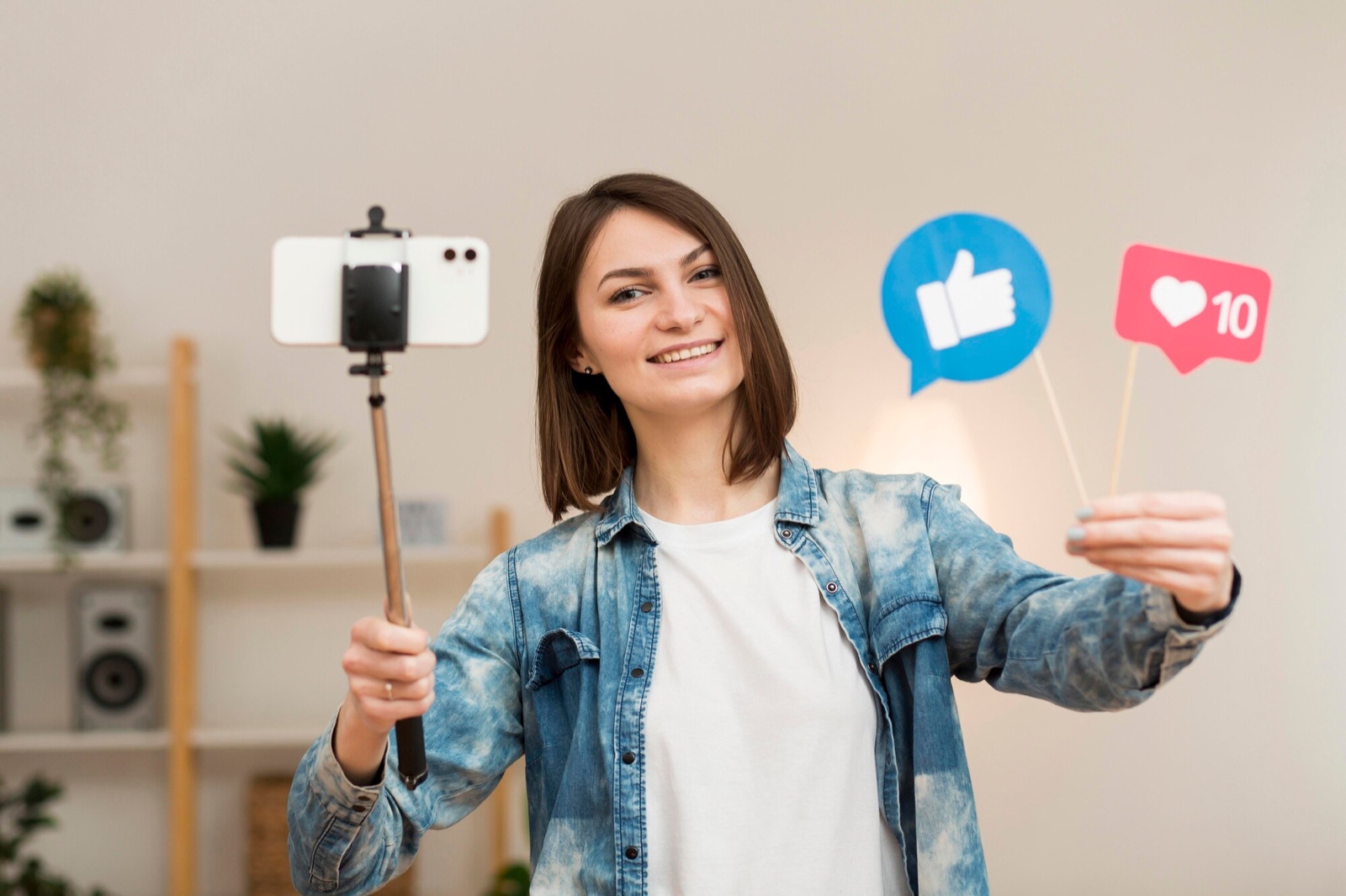 Creator recording with a phone on a selfie stick
